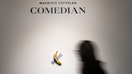 NEW YORK, NEW YORK - OCTOBER 25: People view Maurizio Cattelan's "Comedian" during a press preview for Sotheby's Evening Auction on October 25, 2024 in New York City. The conceptual piece, a banana duct-taped to a wall, went viral in 2019 and one of its three editions is estimated to sell for between $1 million to $1.5 million. (Photo by John Nacion/Getty Images) - Fox Business News