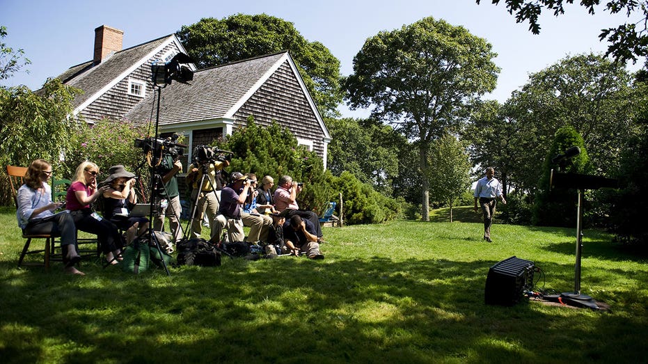US President Barack Obama walks out to make a statement from Blue Heron Farm in Chilmark, Massachusetts.