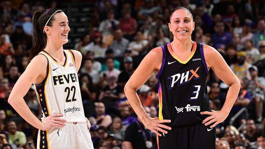 Caitlin Clark and Diana Taurasi smile during a WNBA game