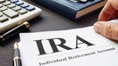 Documents about Individual retirement account IRA on a desk. - Fox Business News