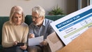 Serious mature couple calculating bills to pay, checking domestic finances, middle aged family managing, planning budget, expenses, grey haired man and woman reading bank loan documents at home - Fox Business News