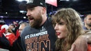  Travis Kelce #87 of the Kansas City Chiefs celebrates with Taylor Swift after a 17-10 victory against the Baltimore Ravens in the AFC Championship Game at M&T Bank Stadium on January 28, 2024 in Baltimore, Maryland. (Photo by Patrick Smith/Getty Images) - Fox Business News