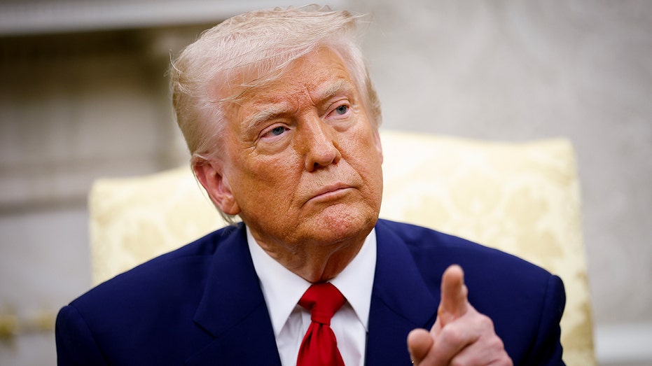 President Donald Trump pointing