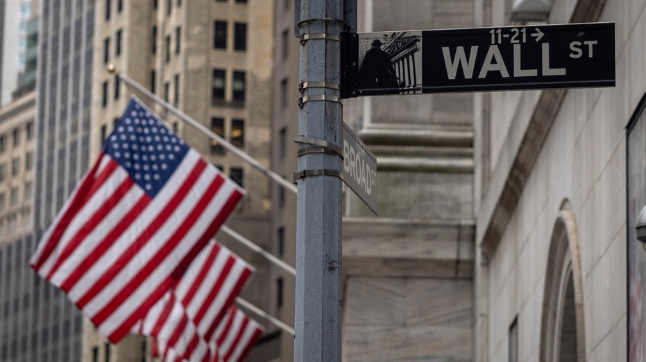 us flags outside wall street in lower Manhattan